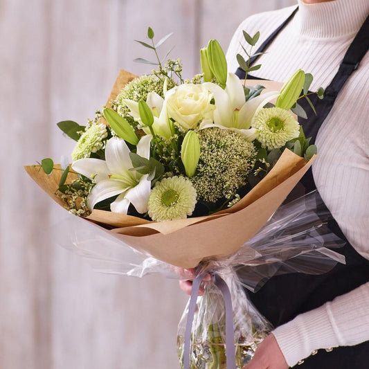 Sympathy hand-tied made with the finest flowers