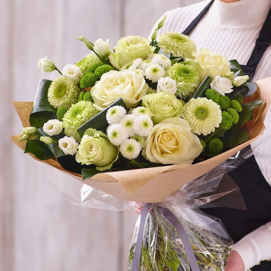 Sympathy hand-tied made with the finest flowers