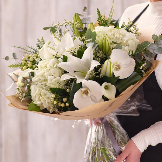 Sympathy hand-tied made with the finest flowers
