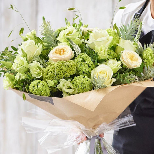 Sympathy hand-tied made with the finest flowers