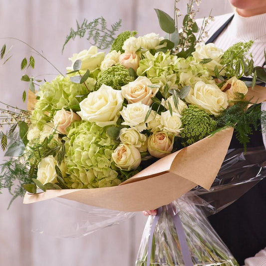 Sympathy hand-tied made with the finest flowers